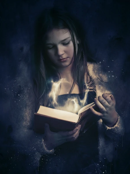 jovem olhando lendo um livro mágico